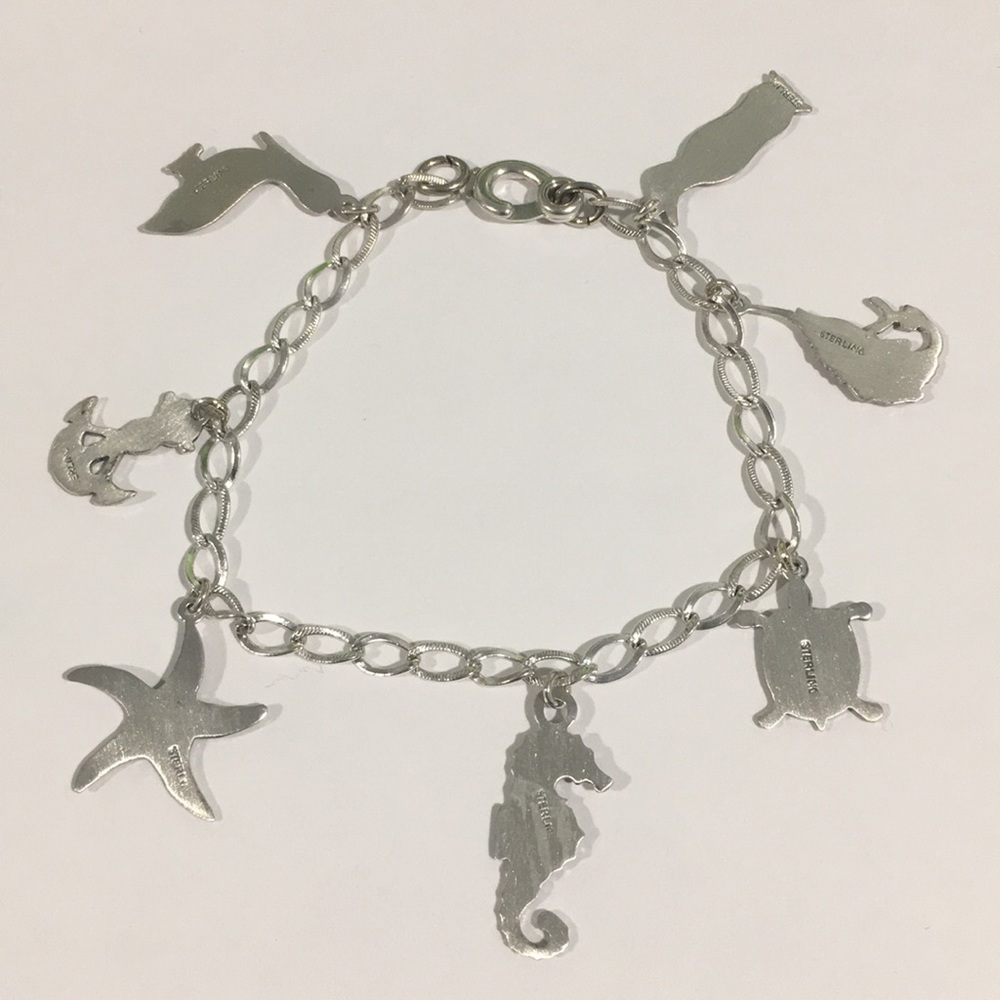 Sterling Silver Bracelet With 7 Different Charms - Picture 2 of 7
